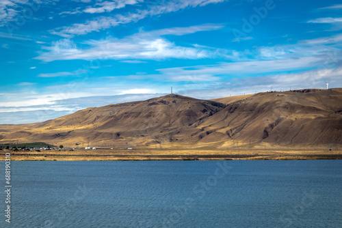 View of the Columbia river from highway 84 showing the river with the desert mountains/ hills on the other side photo