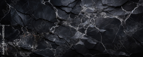 Black marble texture background, abstract pattern of gray lines in dark rock. Panoramic banner of marbled structure close-up. Concept of art, design, stone, surface