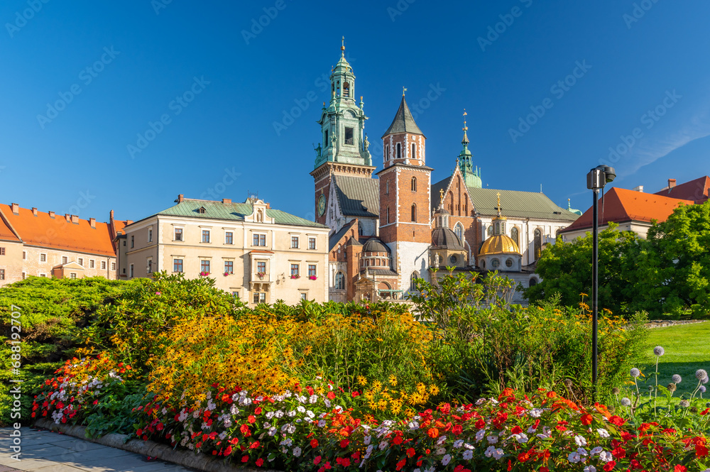 Summer view of Wawel cathedral and Wawel castle with blooming flowers on the Wawel Hill, Krakow, Poland Summer view of Wawel cathedral and Wawel castle with blooming flowers on the Wawel Hill, Krakow, Poland