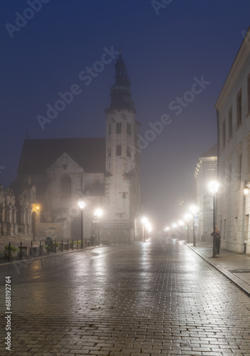 Krakow old town, St Andrew church on Grodzka street in the foggy night. © tomeyk