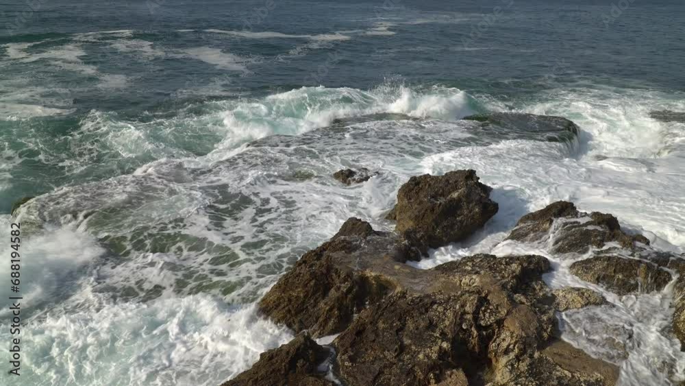 Mediterranean waves crash on the cliffs at the waterfront of Beirut, Lebanon Mediterranean waves crash on the cliffs at the waterfront of Beirut, Lebanon