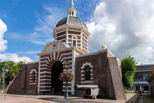 Stone gate Morspoort in city center of Leiden, the Netherlands with octagonal dome built in 1669 in Mannerist style by builder Willem van der Helm (text on building name Morschpoort) photo