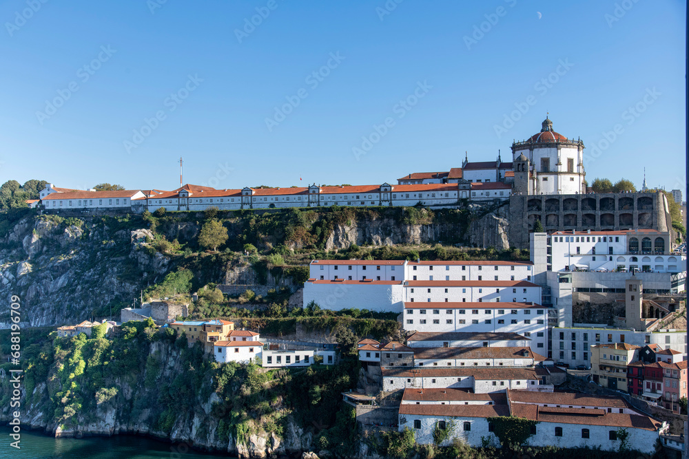 Porto, Portugal, Characteristic white buildings of church and former Monastery of Serra do Pilar along banks of Douro River overlooking the Dom Luís I Bridge