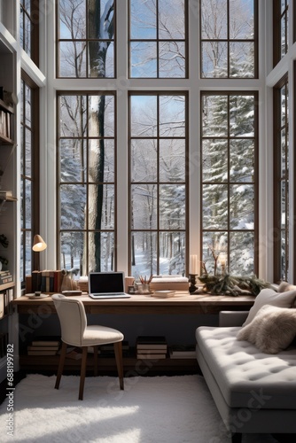 A home office with a view of a snowy landscape 