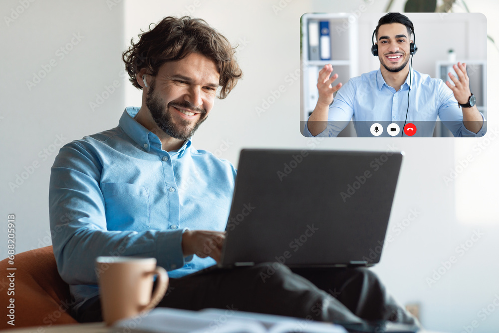 Cheerful Guy Looking At Screen Have Video Call With Colleague Cheerful Guy Looking At Screen Have Video Call With Colleague