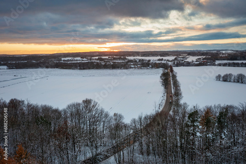 Aerial landscape of the road through snowy forest at winter  Poland.