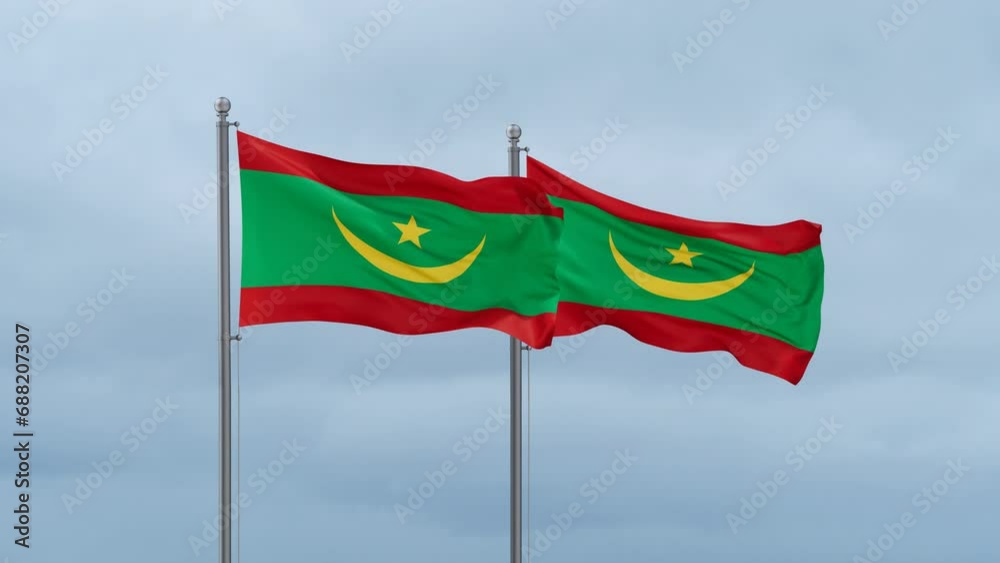 Two Mauritania flag waving together on cloudy sky, endless seamless loop, two country relations concept Two Mauritania flag waving together on cloudy sky, endless seamless loop, two country relations concept