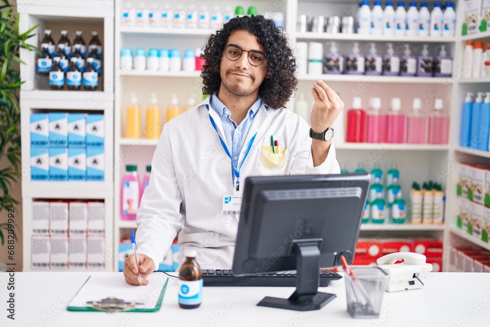 Hispanic man with curly hair working at pharmacy drugstore doing italian gesture with hand and fingers confident expression Hispanic man with curly hair working at pharmacy drugstore doing italian gesture with hand and fingers confident expression