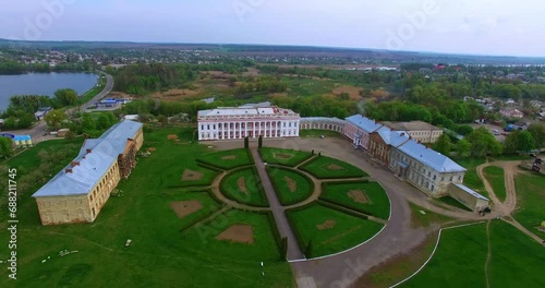 Palace of three parts situated on the river bank. Drone footage approaching the museum. Scenery of town at backdrop. photo