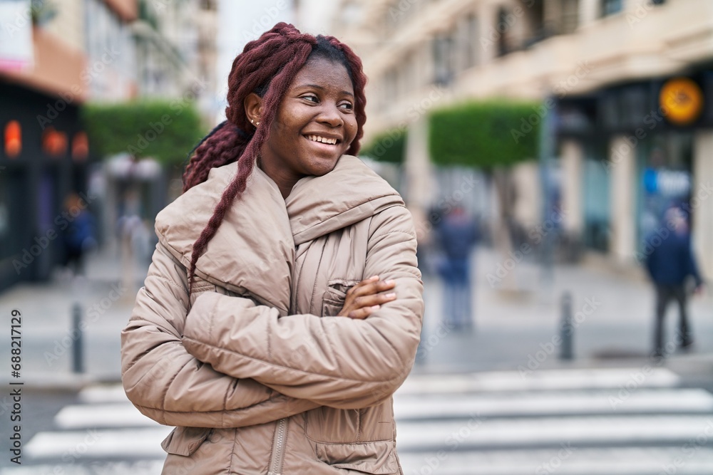 Fototapeta premium African american woman standing with arms crossed gesture at street