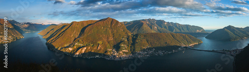 The sunset and the landscape seen from Mount San Salvatore at the end of an autumn day, near the town of Lugano, Ticino, Switzerland - 31 October 2023. photo
