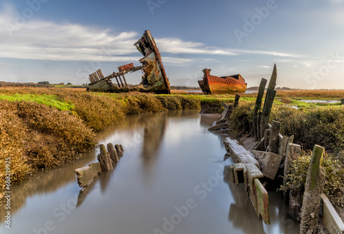 Blackpool shipwrecked boats on the Clyde coast near Blackpool and Fleetwood. Cod war fishing boats abandoned on mud flats photo