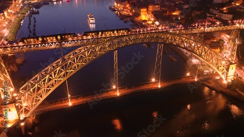 Aerial view of Porto with Luis I Bridge and Douro River at night. High quality 4k footage photo