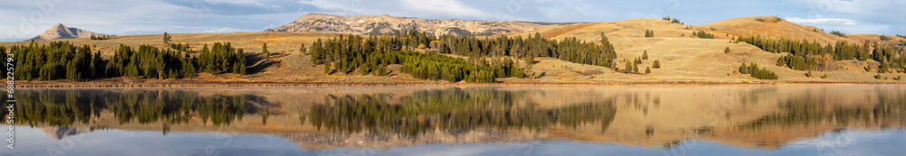 Panorama of a mountain reflecting in a lake in Yellowstone National park Panorama of a mountain reflecting in a lake in Yellowstone National park