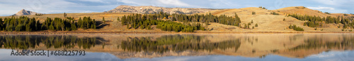 Panorama of a mountain reflecting in a lake in Yellowstone National park