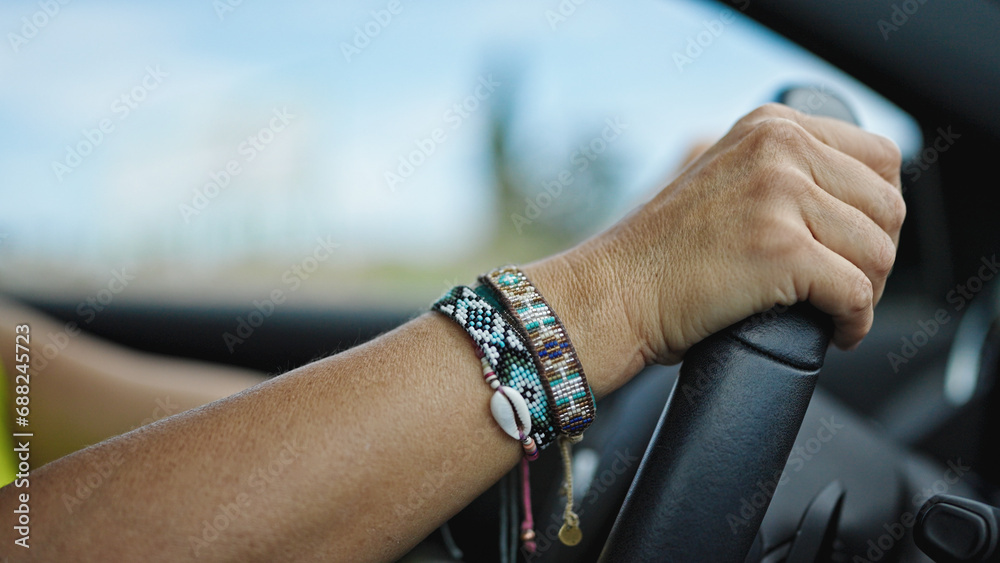 Middle age hispanic woman driving a car on the road Middle age hispanic woman driving a car on the road