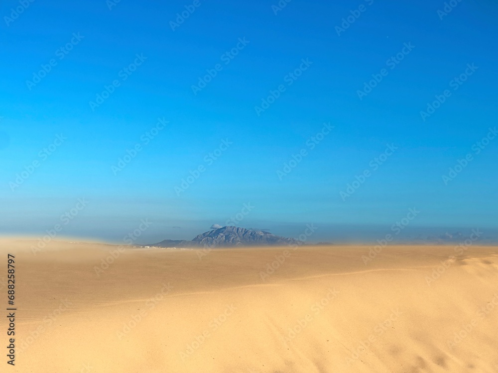 high sand dunes in Valdevaqueros with a view towards the Jbel Musa mountain in Morocco at the horizon, Spain, Tarifa, Andalusia, Strait of Gibraltar, Africa high sand dunes in Valdevaqueros with a view towards the Jbel Musa mountain in Morocco at the horizon, Spain, Tarifa, Andalusia, Strait of Gibraltar, Africa