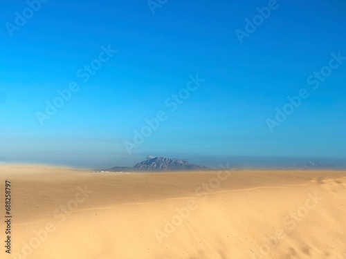 high sand dunes in Valdevaqueros with a view towards the Jbel Musa mountain in Morocco at the horizon, Spain, Tarifa, Andalusia, Strait of Gibraltar, Africa