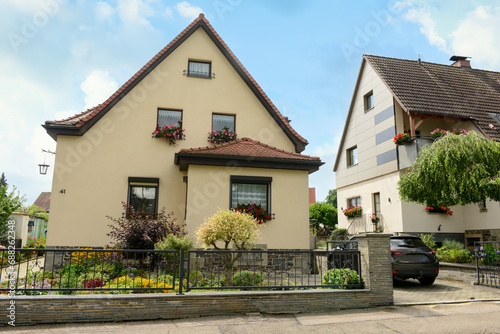 View of beautiful houses in town © Pixel-Shot