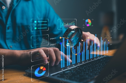 Business and technology Data analyst working on business analytics dashboard with charts, metrics and KPI to analyze performance and create insight reports for operations management. Big data.