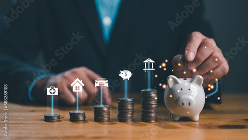 Close up hand businessman, male putting coin into a piggy ceramic for saving cost, financial plans to spend enough money income for saving money and payment, finance people, save money, management.