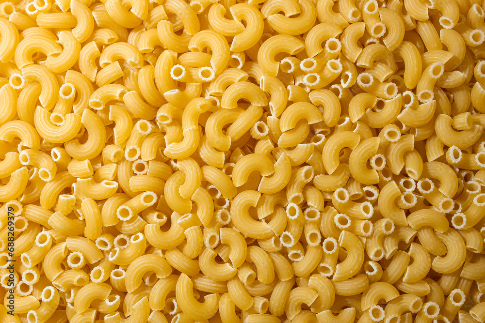 Uncooked Chifferi Rigati Pasta: A Culinary Canvas of Chifferi Rigati, Creating a Lively and Textured Background for Gourmet Cooking. Dry Pasta. Raw Macaroni - Top View, Flat Lay Uncooked Chifferi Rigati Pasta: A Culinary Canvas of Chifferi Rigati, Creating a Lively and Textured Background for Gourmet Cooking. Dry Pasta. Raw Macaroni - Top View, Flat Lay