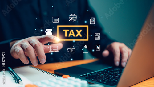 E-tax, Businessman show TAX for Individual income tax return form online for tax payment concept. Government, state taxes. Data analysis, paperwork, financial research, report. Calculation tax return. photo