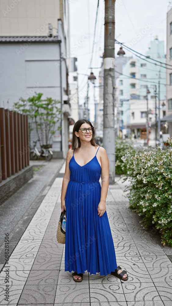 Beautiful hispanic woman in glasses, casually standing and happily smiling, posing her confidence on tokyo's modern streets, looking around, enjoying japan's urban cityscape. Beautiful hispanic woman in glasses, casually standing and happily smiling, posing her confidence on tokyo's modern streets, looking around, enjoying japan's urban cityscape.