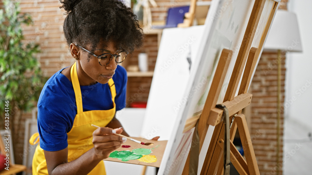 African american woman artist drawing at art studio African american woman artist drawing at art studio