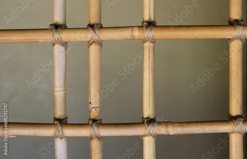Close up abstract background of a brown wooden bamboo trellis