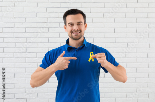 Handsome adult man with yel...