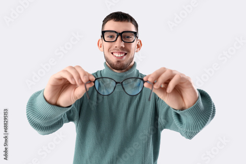 Young man with eyeglasses o...