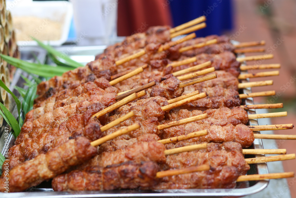 Closeup of grilled meat skewer on the street in Ho Chi Minh City