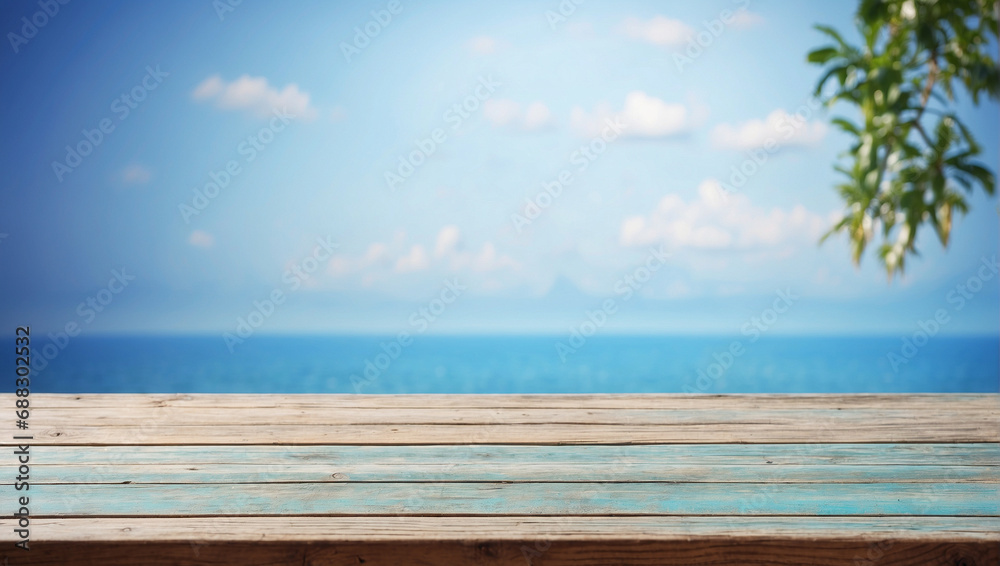 Empty wooden table in front with blurred blue background	