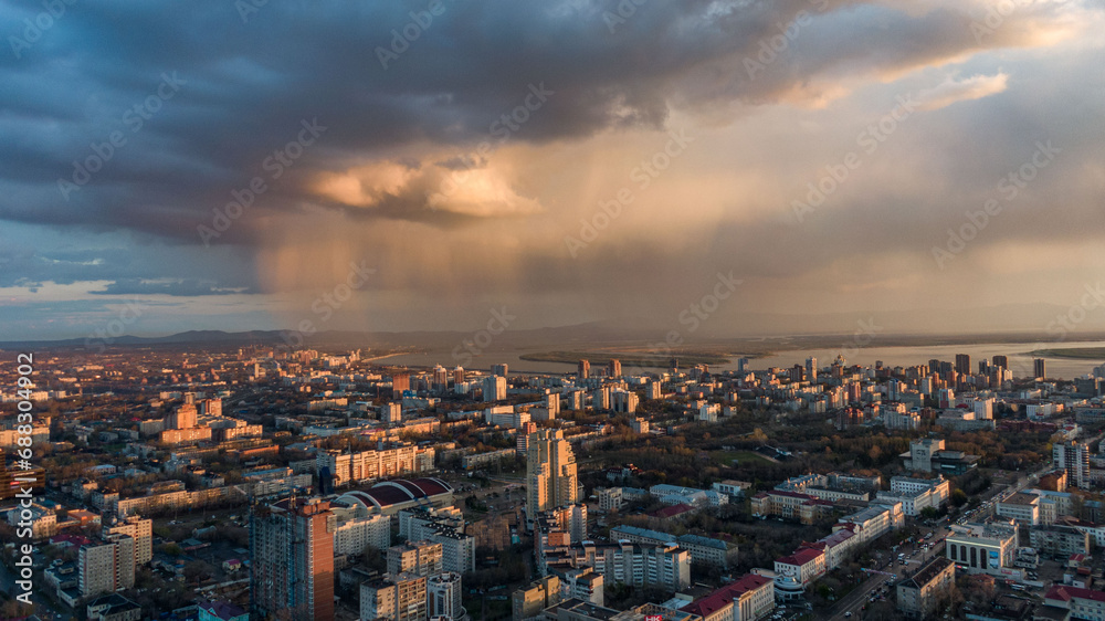 Fototapeta premium Khabarovsk city top view sunset beautiful clouds in the rain