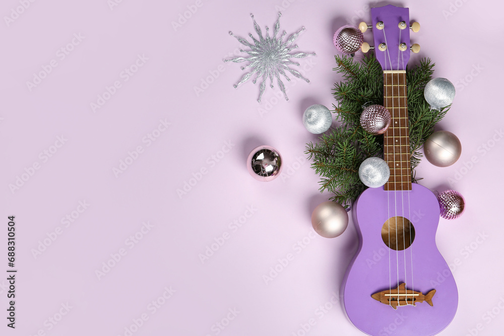Obraz premium Composition with ukulele, fir branches and Christmas decorations on lilac background