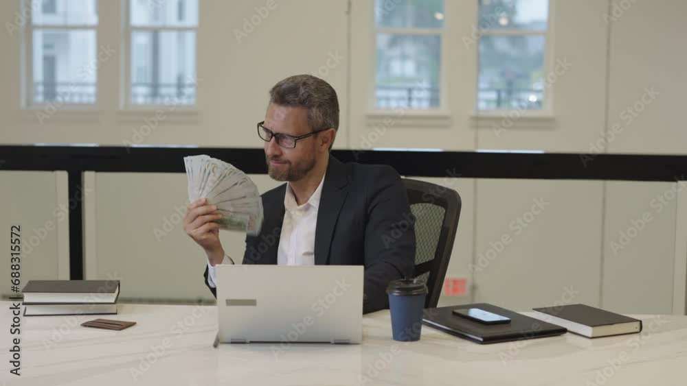 Business man counting dollars in office. Rich man in suit with dollars. Business man hold dollars money banknotes. Boss in suit count dollars. Budget, payment, financial planning. Dollar crisis. Business man counting dollars in office. Rich man in suit with dollars. Business man hold dollars money banknotes. Boss in suit count dollars. Budget, payment, financial planning. Dollar crisis.