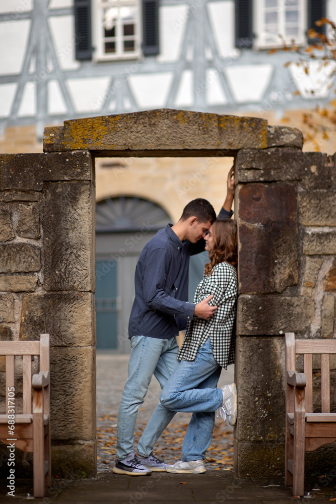 Young Cute Female Hugs Boyfriend. In Autumn Outdoor. Lovers Walking in Park. Attractive Funny Couple. Lovestory in Forest. Man and Woman. Cute Lovers in the Park. Family Concept. Happy Couple.