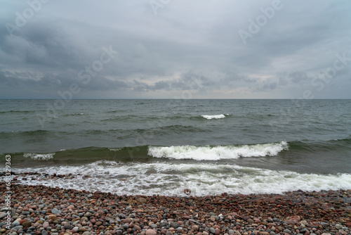 Fototapeta Naklejka Na Ścianę i Meble -  View of the Baltic Sea and a pebble beach on a cloudy summer day, Svetlogorsk, Kaliningrad region, Russia