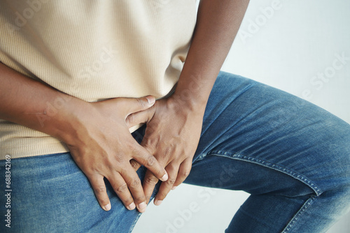 the concept of prostate and bladder problem, crotch pain of a young person  photo