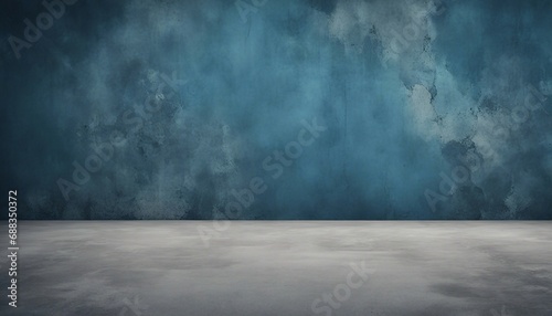 Blue grunge wall with concrete floor.