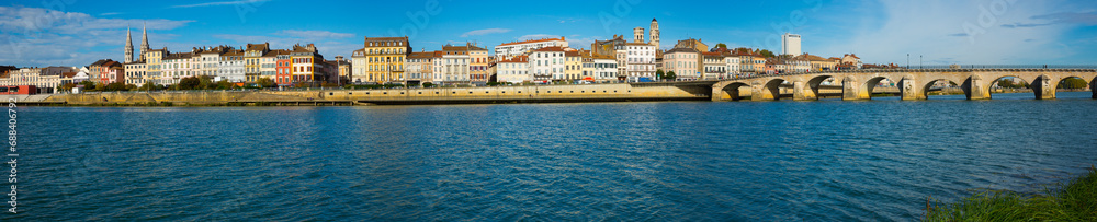 Panoramic view of houses on riverbank of french city Macon