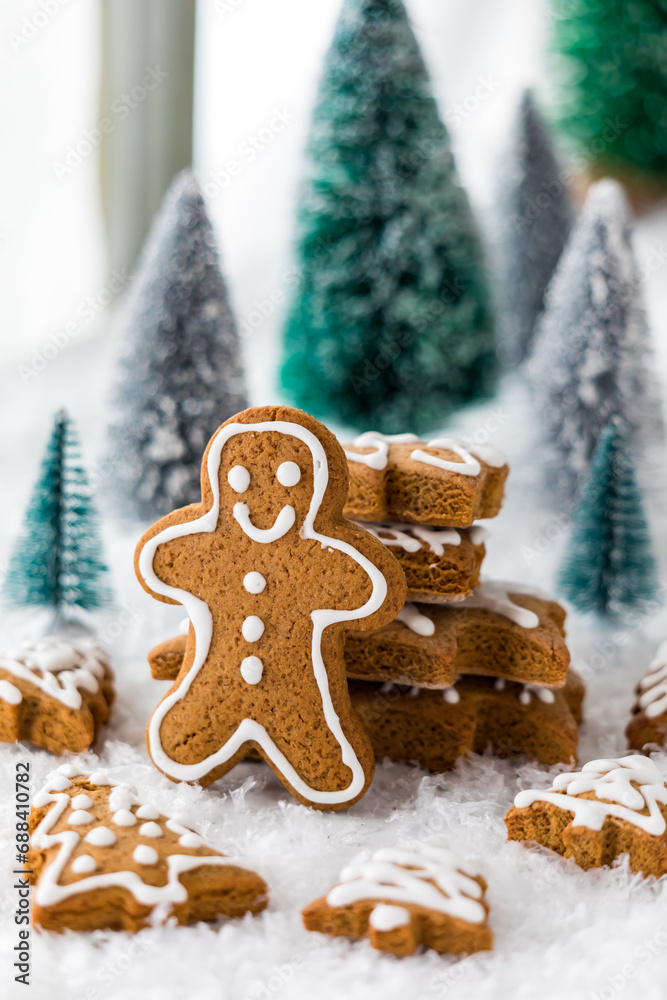 Holiday shaped gingerbread cookies with a gingerbread man in front. Holiday shaped gingerbread cookies with a gingerbread man in front.