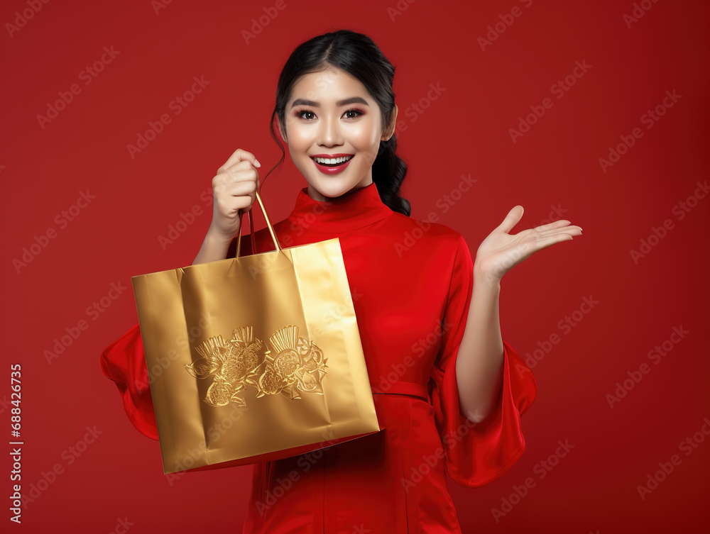 A smiling beautiful asian woman holding shopping bags. Copy space. Isolated on red background. Generative Ai. A smiling beautiful asian woman holding shopping bags. Copy space. Isolated on red background. Generative Ai.