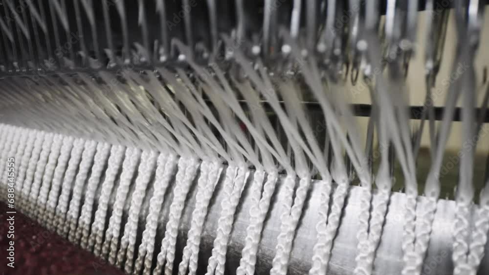 Automated weaving machine fabricate net from white thread - close up. Automated weaving machine fabricate net from white thread - close up.