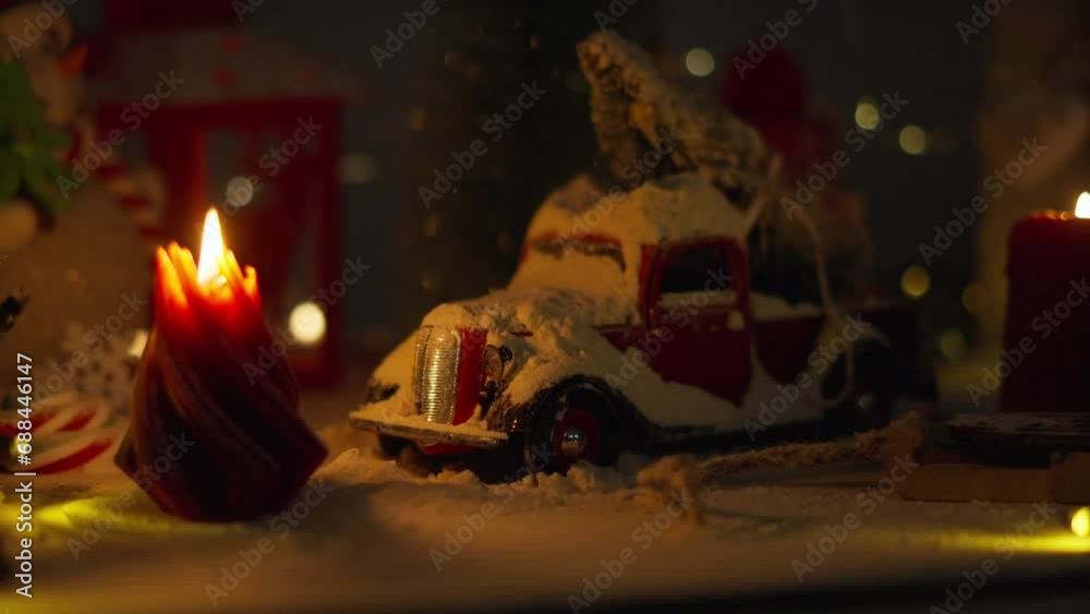 A Christmas display with a miniature car and a Christmas tree on the roof. A warm cinematic shoot in retro style with a large film grain. A Christmas display with a miniature car and a Christmas tree on the roof. A warm cinematic shoot in retro style with a large film grain.