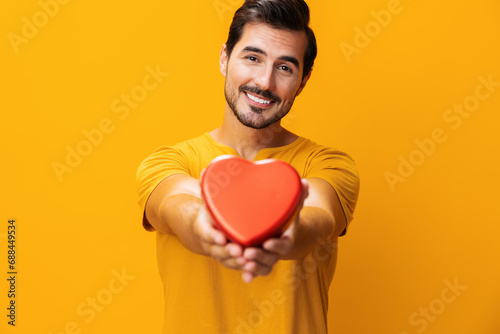 Man romance concept portrait shape happy studio yellow gift valentine romantic smiling love heart © SHOTPRIME STUDIO