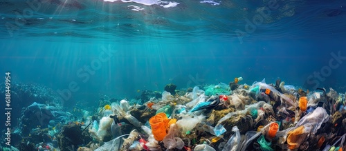 Marine life endangered by plastic waste on coral reef. © 2rogan