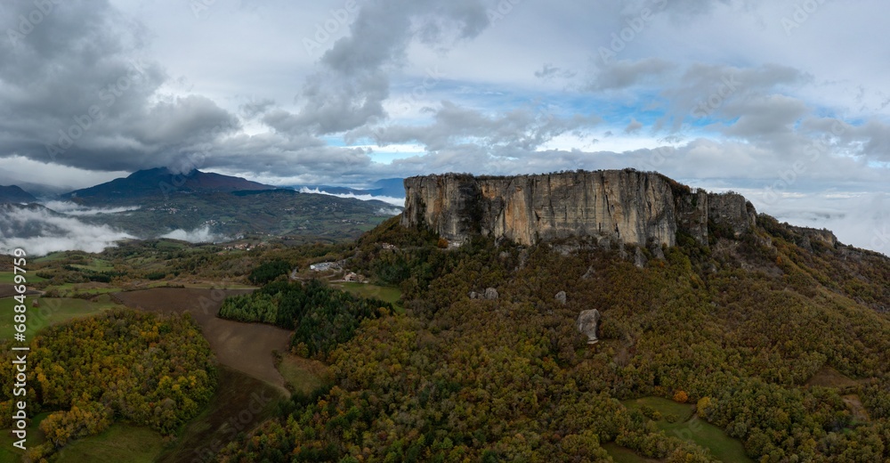 drone view of the Pietra di Bismantova mesa and mountain landscape near Castelnovo 'ne Monti