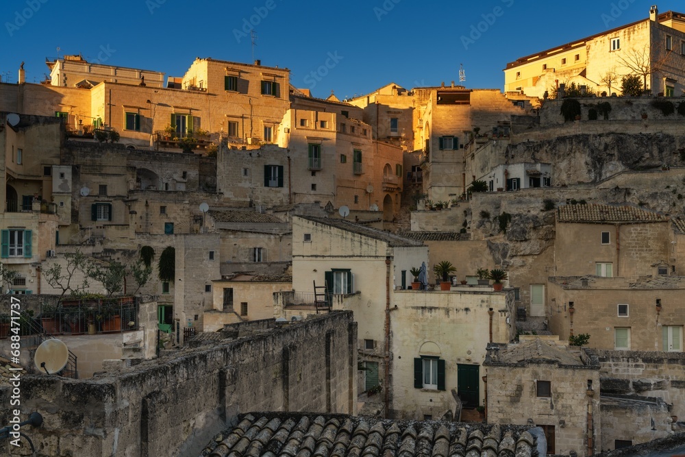 close-up view of the old city center of Matera with the stone houses in the last rays of sunlight